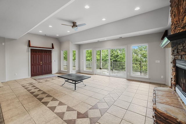 1853 Lafever Ridge Rd, Silver Point, TN 38582 - unfurnished living room featuring recessed lighting, a stone fireplace, tile patterned flooring, healthy amount of natural light, and a ceiling fan