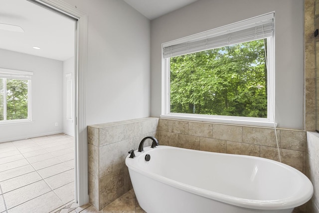 1853 Lafever Ridge Rd, Silver Point, TN 38582 - bathroom with a freestanding tub and tile patterned flooring