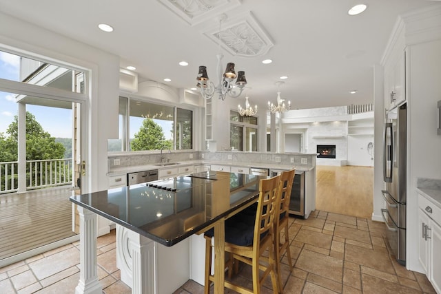 1853 Lafever Ridge Rd, Silver Point, TN 38582 - kitchen with healthy amount of natural light, a sink, open floor plan, white cabinets, and recessed lighting