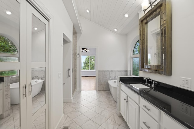 1853 Lafever Ridge Rd, Silver Point, TN 38582 - bathroom featuring marble finish floors, tile walls, vanity, recessed lighting, and a shower stall