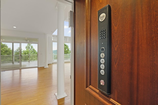 1853 Lafever Ridge Rd, Silver Point, TN 38582 - elevator with wood finished floors and ornate columns