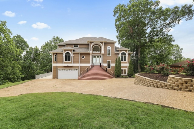 1853 Lafever Ridge Rd, Silver Point, TN 38582 - view of front of house featuring concrete driveway, an attached garage, stairway, a front yard, and a shingled roof