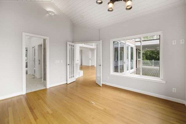 1853 Lafever Ridge Rd, Silver Point, TN 38582 - spare room featuring light wood finished floors, baseboards, and vaulted ceiling