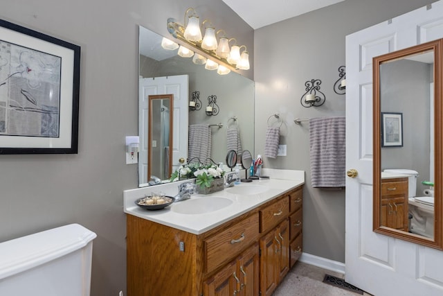 154 Jasons Way, Leoma, TN 38468 - bathroom with toilet, double vanity, and baseboards