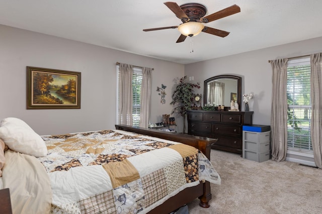 154 Jasons Way, Leoma, TN 38468 - bedroom featuring multiple windows, light colored carpet, and a ceiling fan