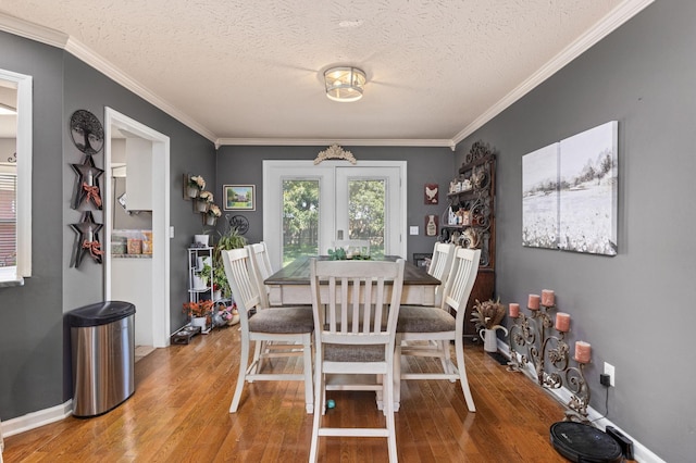 154 Jasons Way, Leoma, TN 38468 - dining room featuring wood finished floors, crown molding, a textured ceiling, baseboards, and a chandelier