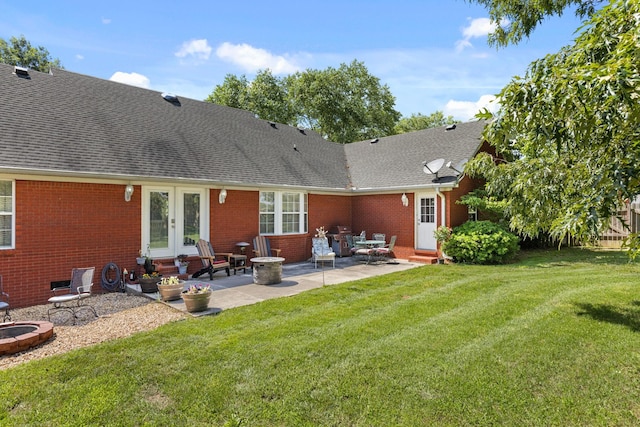 154 Jasons Way, Leoma, TN 38468 - back of house featuring french doors, brick siding, roof with shingles, and a yard