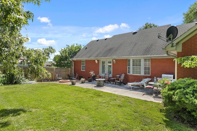 154 Jasons Way, Leoma, TN 38468 - back of property featuring french doors, a fire pit, brick siding, a patio, and roof with shingles