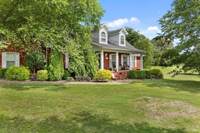 154 Jasons Way, Leoma, TN 38468 - view of front of house with a porch, brick siding, and a front yard