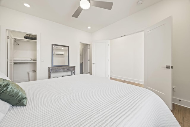 3746 Central Pike Unit 15, Hermitage, TN 37076 - bedroom featuring wood finished floors, a walk in closet, baseboards, a closet, and a ceiling fan