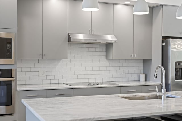 3746 Central Pike Unit 15, Hermitage, TN 37076 - kitchen with stainless steel appliances, under cabinet range hood, gray cabinets, and a sink