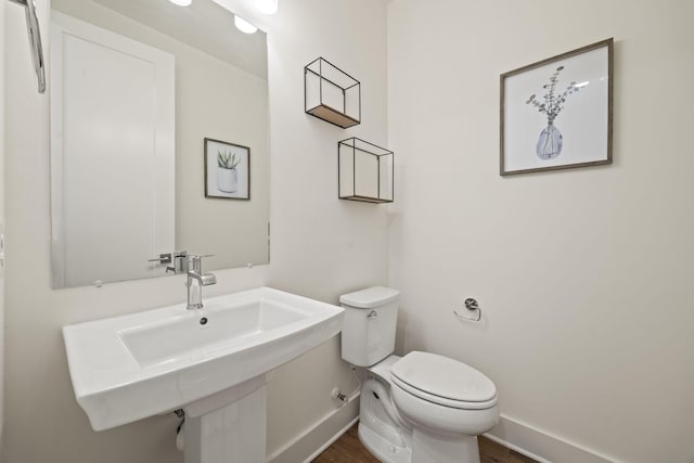 3746 Central Pike Unit 15, Hermitage, TN 37076 - half bath featuring baseboards, toilet, wood finished floors, and a sink