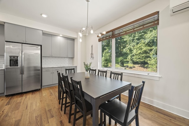 3746 Central Pike Unit 15, Hermitage, TN 37076 - dining room with a wall mounted air conditioner, light wood-style flooring, baseboards, a chandelier, and recessed lighting