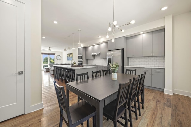 3746 Central Pike Unit 15, Hermitage, TN 37076 - dining area with wood finished floors, baseboards, recessed lighting, and a chandelier