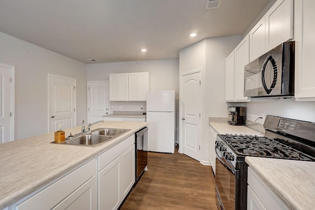 18 Pointer Pl, Lebanon, TN 37087 - kitchen featuring black appliances, dark wood-type flooring, recessed lighting, white cabinetry, and light countertops