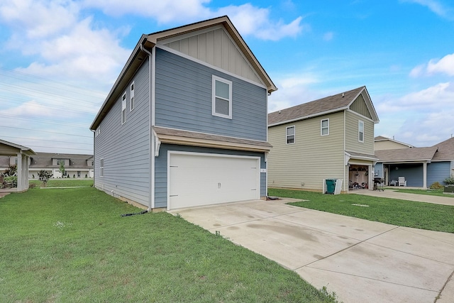 18 Pointer Pl, Lebanon, TN 37087 - view of front of property featuring a garage, a front yard, concrete driveway, and board and batten siding