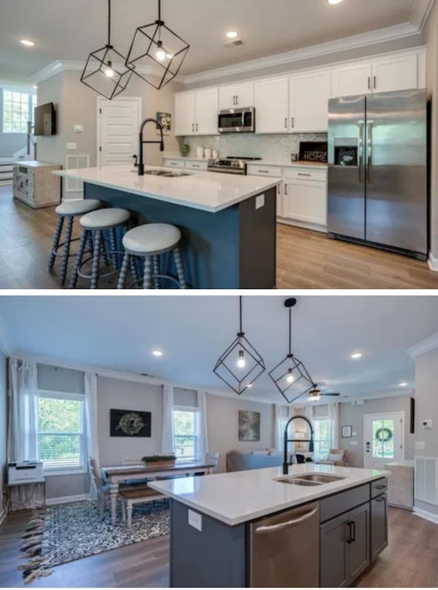 1727 Fenway Loop, Antioch, TN 37013 - kitchen with stainless steel appliances, a kitchen island with sink, a sink, open floor plan, and crown molding