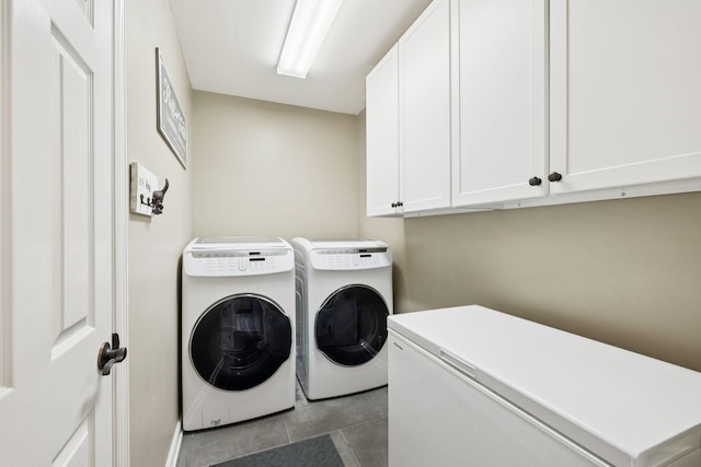 119 Abercairn Dr, Franklin, TN 37064 - laundry room featuring separate washer and dryer, cabinet space, and tile patterned floors