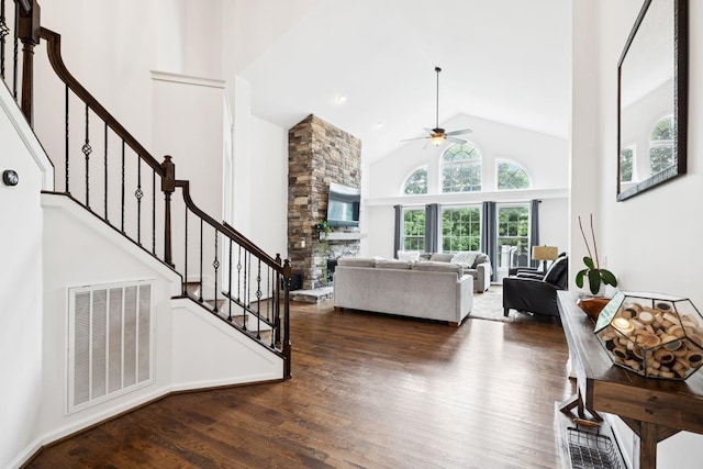 119 Abercairn Dr, Franklin, TN 37064 - living room with high vaulted ceiling, ceiling fan, stairway, wood finished floors, and a stone fireplace