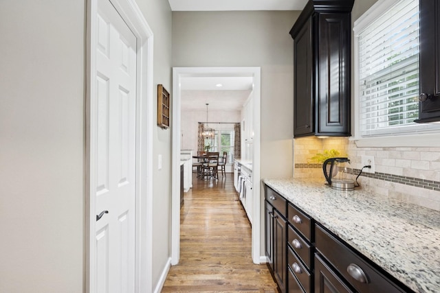 119 Abercairn Dr, Franklin, TN 37064 - hall featuring light wood finished floors, a chandelier, and baseboards