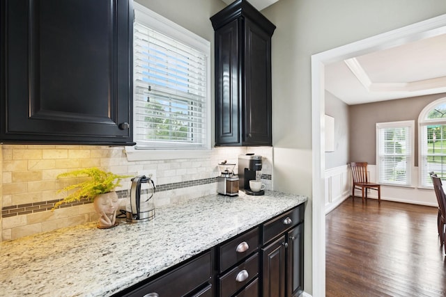 119 Abercairn Dr, Franklin, TN 37064 - kitchen featuring dark wood finished floors, decorative backsplash, wainscoting, light stone counters, and a tray ceiling