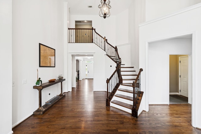 119 Abercairn Dr, Franklin, TN 37064 - foyer entrance featuring stairs, wood finished floors, a towering ceiling, a chandelier, and baseboards