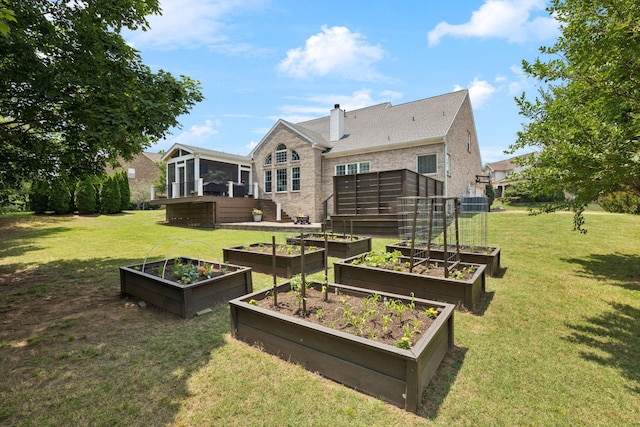 119 Abercairn Dr, Franklin, TN 37064 - back of property with a garden, a sunroom, a chimney, and a lawn