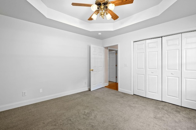 2520 Johnson Ridge Rd, Antioch, TN 37013 - unfurnished bedroom with carpet flooring, baseboards, a tray ceiling, a closet, and ceiling fan
