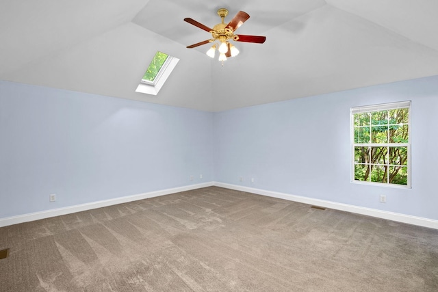 2520 Johnson Ridge Rd, Antioch, TN 37013 - additional living space featuring vaulted ceiling, a skylight, a ceiling fan, carpet floors, and baseboards
