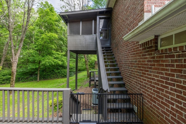 2520 Johnson Ridge Rd, Antioch, TN 37013 - deck with stairway, a lawn, and a sunroom