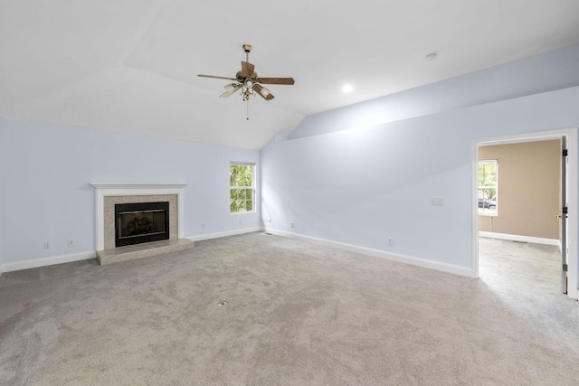 2520 Johnson Ridge Rd, Antioch, TN 37013 - unfurnished living room with a ceiling fan, a tile fireplace, carpet floors, lofted ceiling, and baseboards