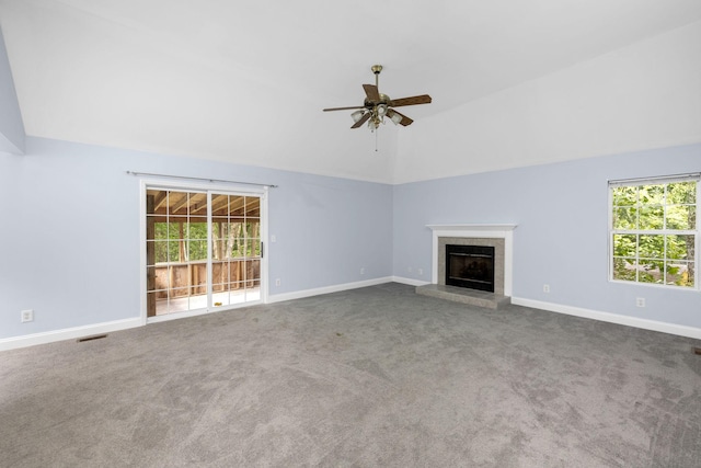 2520 Johnson Ridge Rd, Antioch, TN 37013 - unfurnished living room with vaulted ceiling, a ceiling fan, plenty of natural light, carpet, and a tiled fireplace