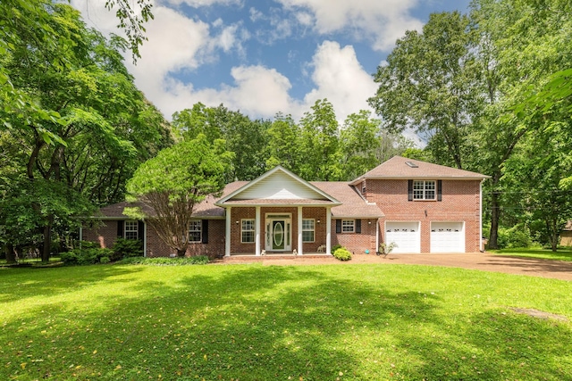2520 Johnson Ridge Rd, Antioch, TN 37013 - view of front of house featuring driveway, an attached garage, brick siding, and covered porch