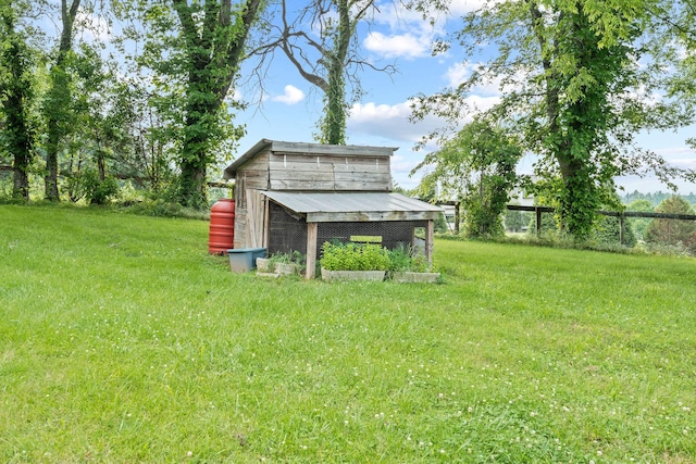 4291 Skelley Rd, Santa Fe, TN 38482 - view of grassy yard with exterior structure and an outbuilding