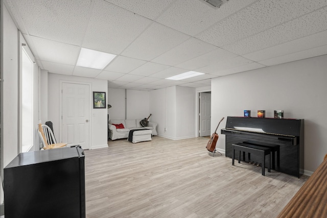 4291 Skelley Rd, Santa Fe, TN 38482 - living area with light wood-type flooring, a paneled ceiling, and baseboards