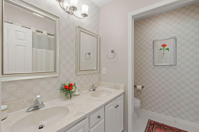 4291 Skelley Rd, Santa Fe, TN 38482 - bathroom featuring double vanity, toilet, and baseboards