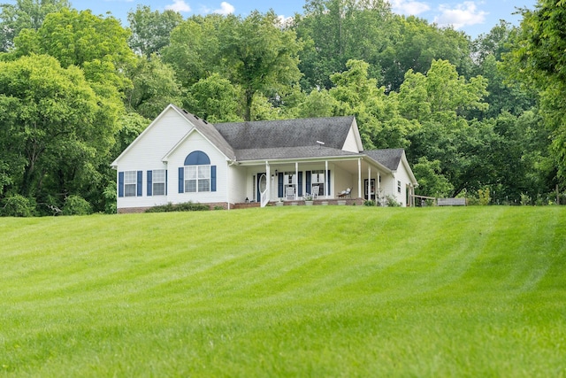 4291 Skelley Rd, Santa Fe, TN 38482 - view of front facade with covered porch, a front lawn, and roof with shingles