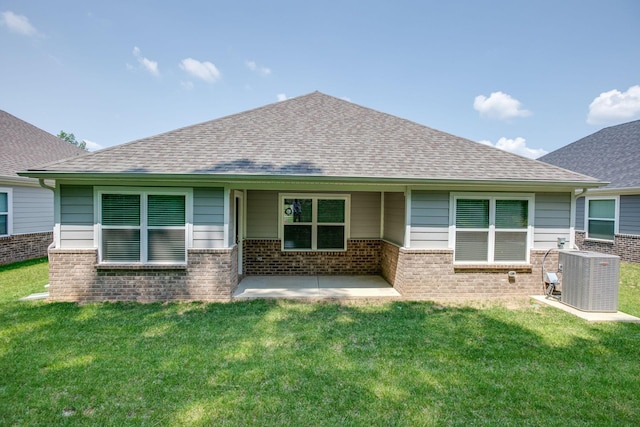 1003 Autumnwood Dr, Dickson, TN 37055 - view of front of house featuring brick siding, a shingled roof, a patio, and a front lawn