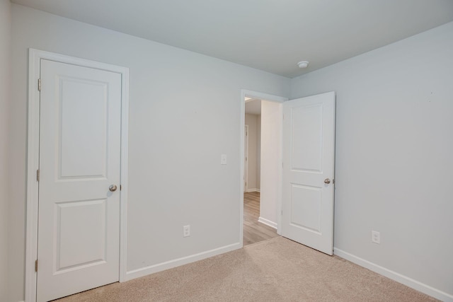 1003 Autumnwood Dr, Dickson, TN 37055 - unfurnished bedroom with light carpet and baseboards