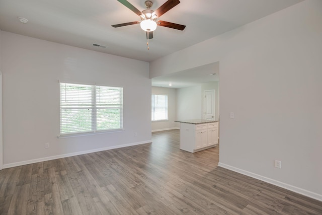 1003 Autumnwood Dr, Dickson, TN 37055 - spare room with wood finished floors, a ceiling fan, and a smoke detector