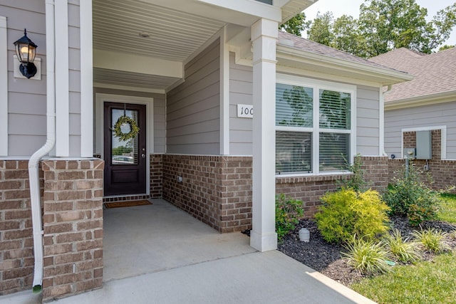 1003 Autumnwood Dr, Dickson, TN 37055 - entrance to property with brick siding, a shingled roof, and a porch