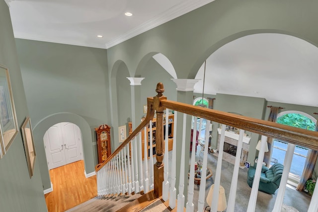 4090 Ironwood Dr, Greenbrier, TN 37073 - stairway featuring arched walkways, recessed lighting, crown molding, wood finished floors, and ornate columns