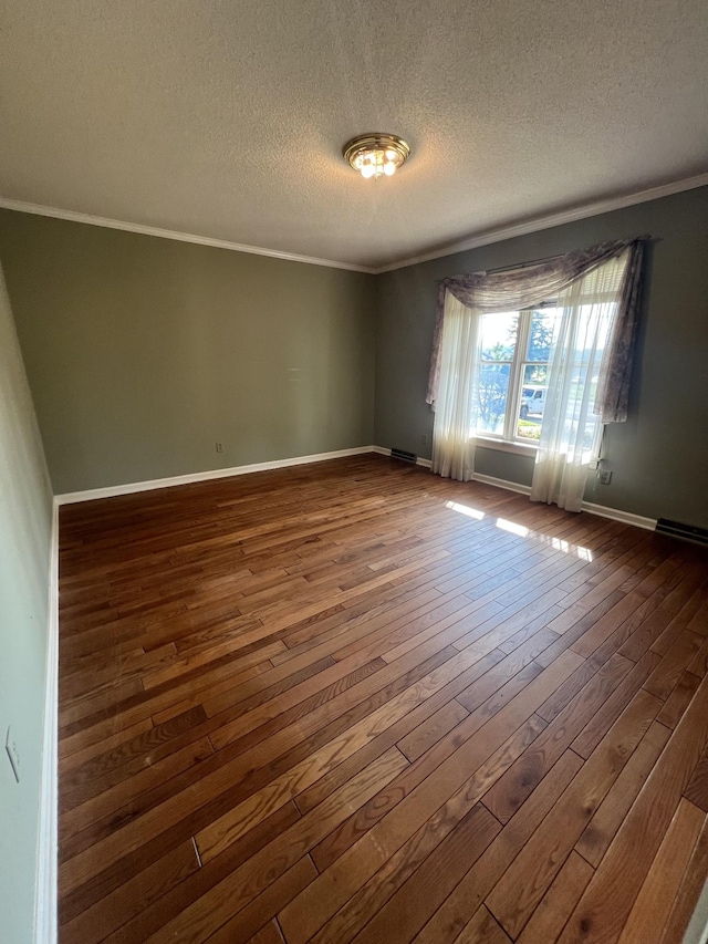 212 N 3rd St, Pulaski, TN 38478 - empty room featuring dark wood-style floors, crown molding, a textured ceiling, and baseboards