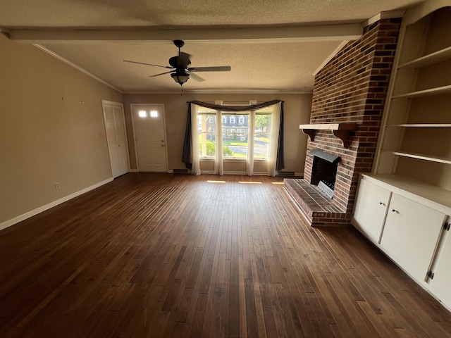 212 N 3rd St, Pulaski, TN 38478 - unfurnished living room featuring a ceiling fan, dark wood-type flooring, a fireplace, baseboards, and crown molding