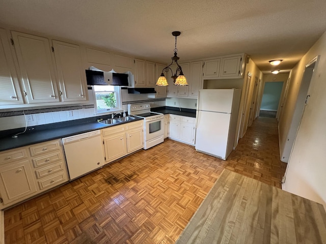 212 N 3rd St, Pulaski, TN 38478 - kitchen featuring white appliances, a sink, dark countertops, pendant lighting, and a textured ceiling
