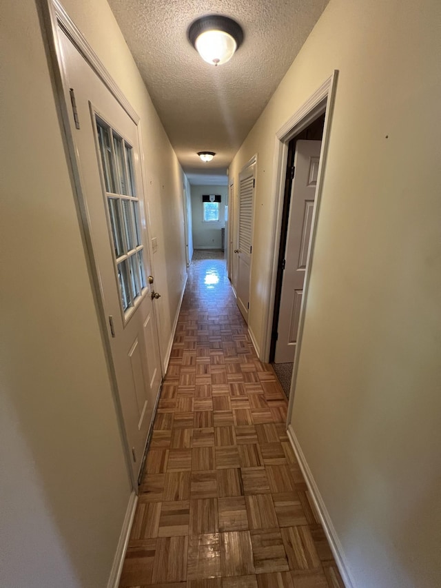 212 N 3rd St, Pulaski, TN 38478 - corridor featuring a textured ceiling and baseboards