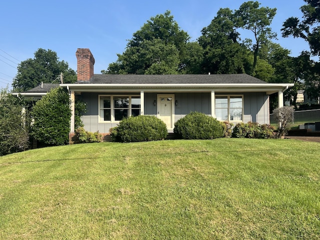 212 N 3rd St, Pulaski, TN 38478 - ranch-style home with a chimney, board and batten siding, a front yard, and roof with shingles