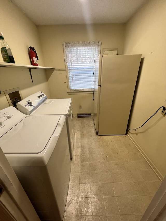 212 N 3rd St, Pulaski, TN 38478 - laundry room with washing machine and dryer and baseboards