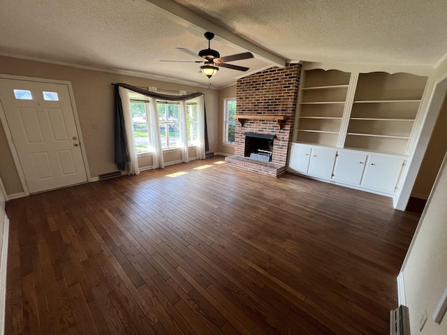 212 N 3rd St, Pulaski, TN 38478 - unfurnished living room with a textured ceiling, a ceiling fan, dark wood-style flooring, a brick fireplace, and baseboards