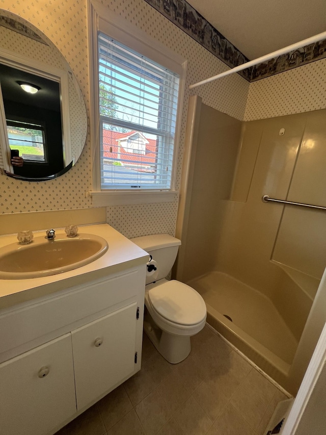 212 N 3rd St, Pulaski, TN 38478 - full bathroom featuring wallpapered walls, a shower, vanity, toilet, and tile patterned flooring